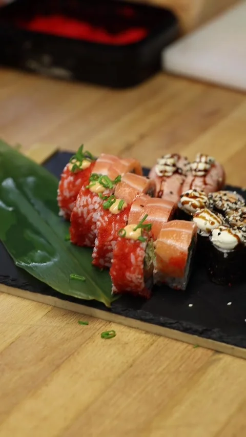 The process of making sushi rolls in a professional restaurant kitchen Видео 332490363