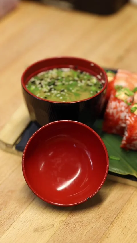 The process of making sushi rolls in a professional restaurant kitchen Видео 332490378