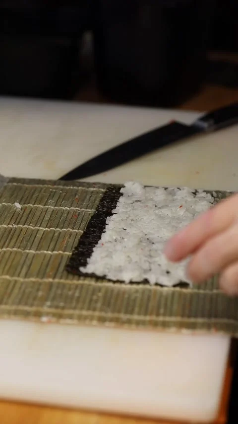 The process of making sushi rolls in a professional restaurant kitchen Video stock 332490379