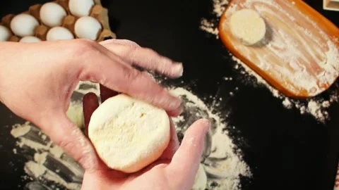 Process of making syrniki. Step 10 - form round syrniki from curd dough. Top Stock Footage 309015704