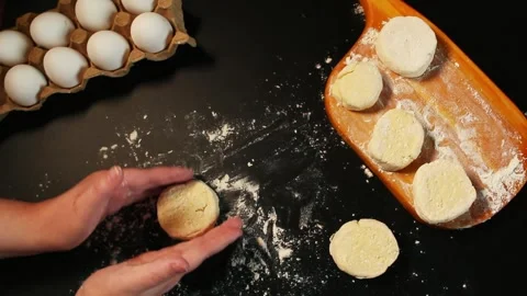 Process of making syrniki. Step 10 - form round syrniki from curd dough Stock Footage 311190269