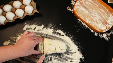 Process of making syrniki. Step 8 - from finished curd dough cut off pieces Stock Footage 309015758