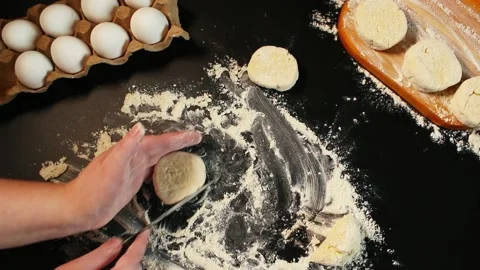 Process of making syrniki. Step 9 - form round syrniki from curd dough using Stock Footage 311779984