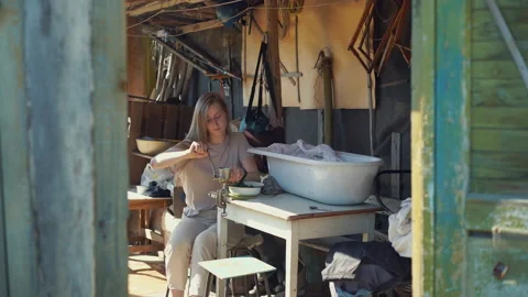 The process of making tea, willow-herb, manual labor Stockbeeldmateriaal 134321873