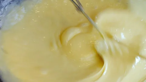 The process of making thin pancake batter. Close-up of mixing the pancake batter Video stock 275892681