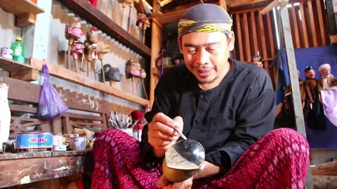 The process of making traditional wooden puppet shows from wood, with a Stock Footage 139601187