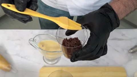 The process of making a trifle cake in transparent cups, creating confectionery Stock Footage 245537308