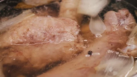 Process of making turkey soup. Boiling broth with turkey legs and vegetables Video stock 313191181