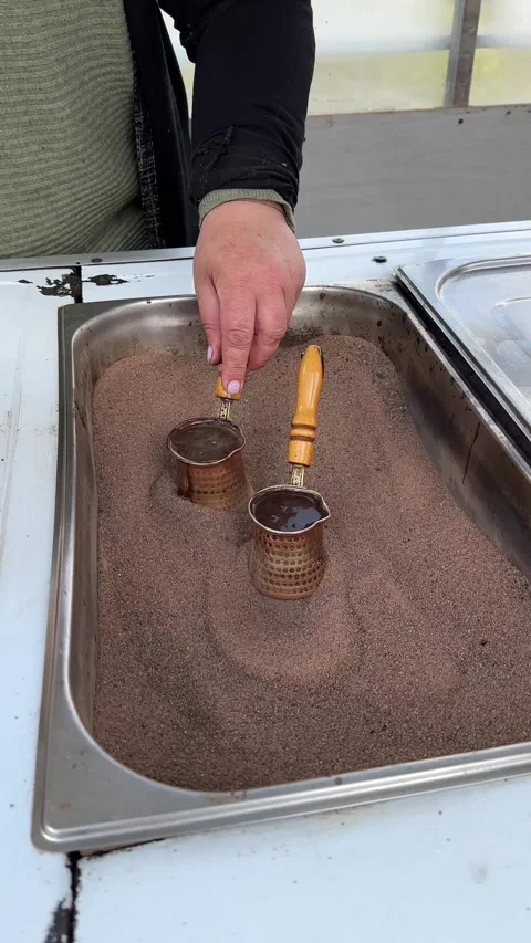 The process of making Turkish coffee on the sand. Vertical Stock Footage 309394307