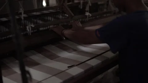 The process of making typical Indonesian woven fabrics using manual machines. Stock Footage 248447349
