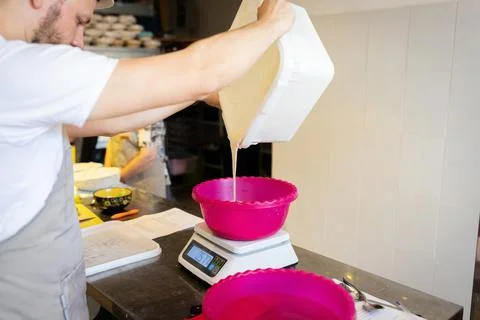 The process of making wheat bread. The baker adds Stock Photos