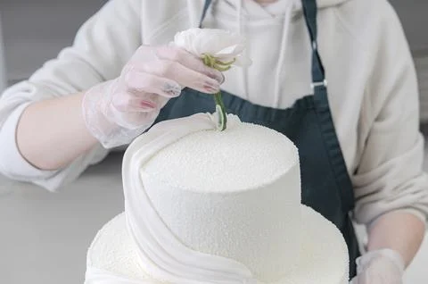 Process making white wedding cake Stock Photos