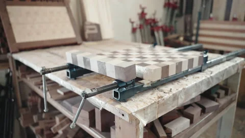 Process of making wooden board with chess pattern in carpentry workshop, artisan 動画素材 164663575