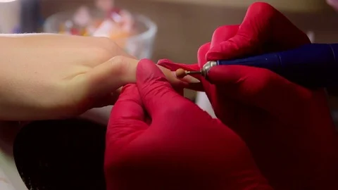 The process of manicure, cuticle removal using the device Stock Footage 101280681