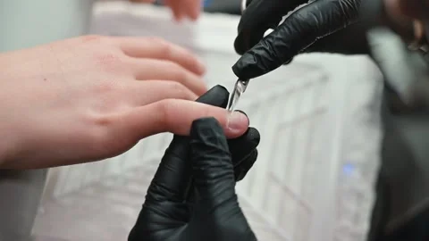 The process of manicuring focuses on shaping and polishing the nails performed Stock Footage 339093816