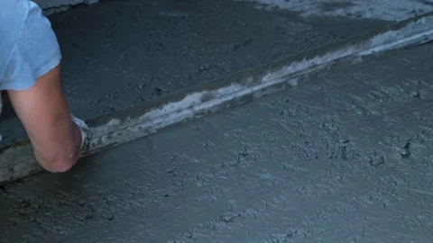 Process Manual concrete placement and leveling with a concrete screed leveler Stock Footage 318418094