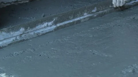Process Manual concrete placement and leveling with a concrete screed leveler Stock Footage 318869915