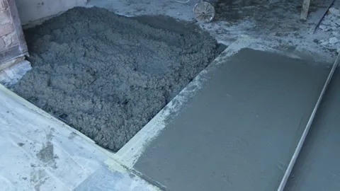 Process Manual concrete placement and leveling with a concrete screed leveler Stock Footage 321222430