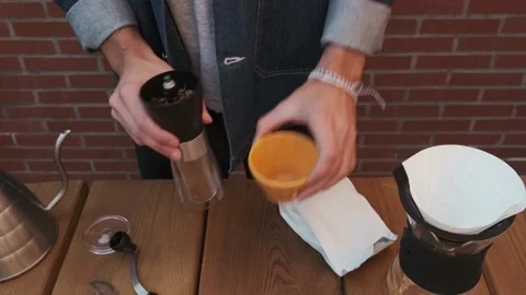 Process of manually grind coffee beans for hario V60. Stock Footage 145811285