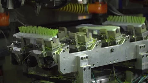 Process of manufacturing brushes on an automated machine close-up 4k. Stock Footage 77821929