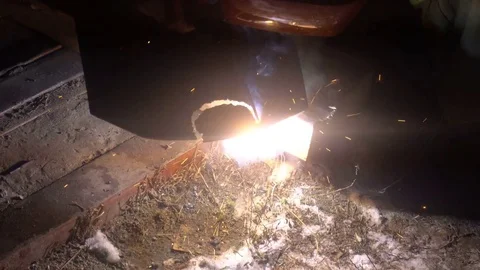 The process of manufacturing a decorative metal product. Metal sparks fly apart 動画素材 83324132