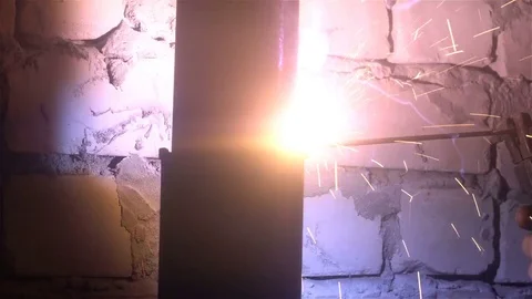 The process of manufacturing a decorative metal product. Metal sparks fly apart Stock Footage 83325979