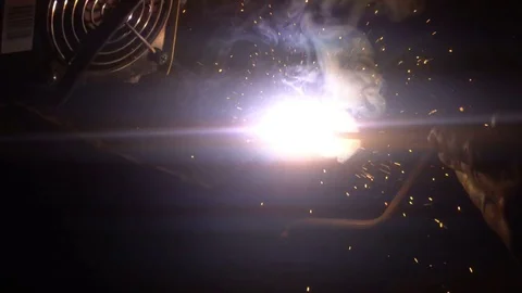 The process of manufacturing a decorative metal product. Metal sparks fly apart Видео 83327382