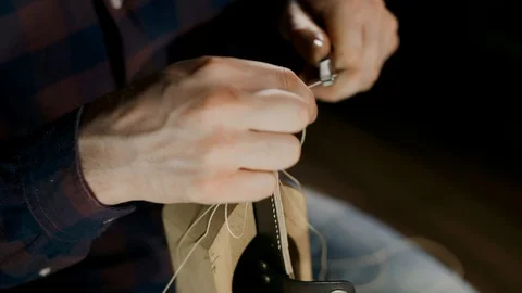 The process of manufacturing a leather wallet handmade. The artisan sewes a Stock Footage 93390319