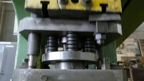 Process of manufacturing metal part on a press machine. Automatic stamping Stock Footage 87725852