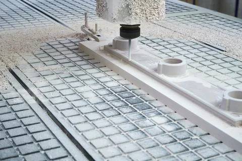 The process of manufacturing a part of complex shape from plastic on a CNC Stock Photos