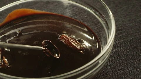 Process of manufacturing sweets with dates covered dark chocolate Stock Footage 117500946