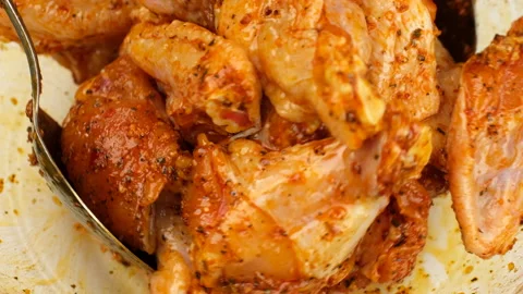 Process marinated chicken wings in sauce Stock Footage 245530788