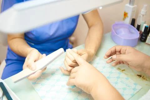 The process of the master of manicure and pedicure close-up Photos