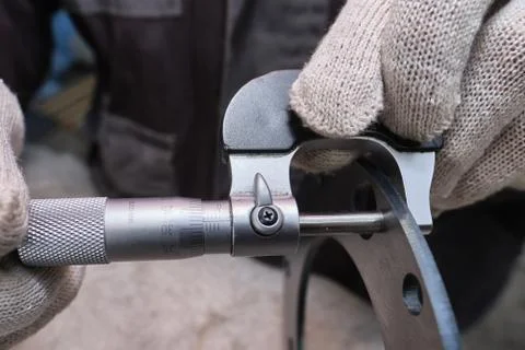 The process of measuring the ring of a large diesel engine in a machine-build Stock Photos