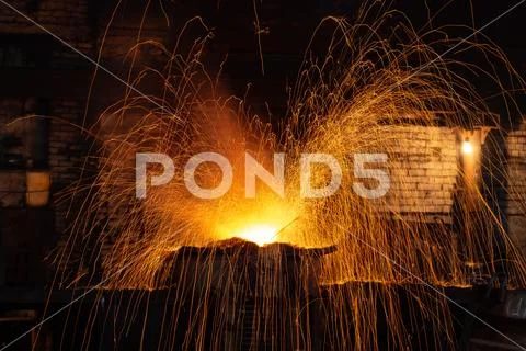 The process of melting steel in the steel factory Stock Photos