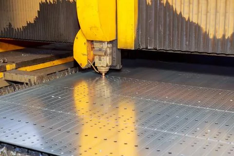 The process of metal cutting on a CNC laser machine, industrial technologies. Stock Photos