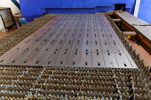 The process of metal cutting on a CNC laser machine, industrial technologies. Stock Photos