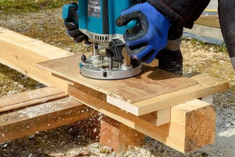 The process of milling wood with a circular machine. Passion for wood carving Stock Photos