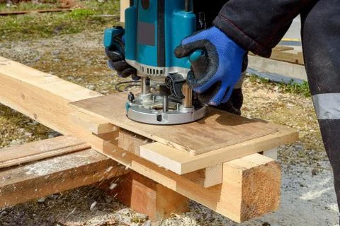 The process of milling wood with a circular machine. Passion for wood carving Stock Photos