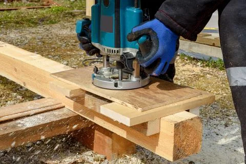 The process of milling wood with a circular machine. Passion for wood carving Stock Photos