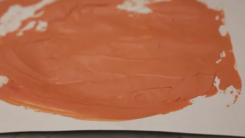The process of mixing acrylic paints on a white background using a spatula Stock Footage 279940188