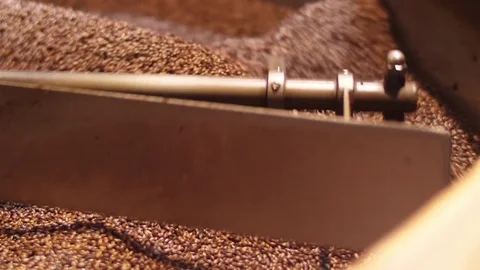 Process of mixing and roasting coffee beans production slow motion Stock Footage 83176346