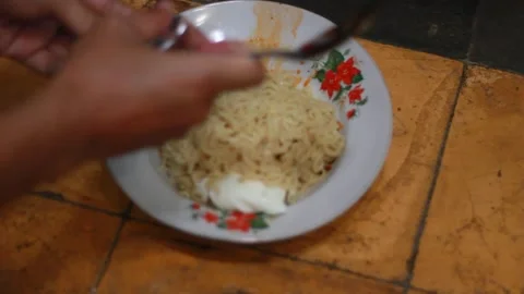 The process of mixing cooked noodles with spices Stock Footage 280444281