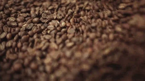 The process of mixing freshly roasted coffee beans. The process of cooling Video stock 69084442
