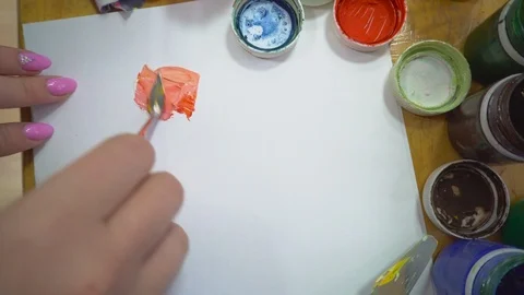 The process of mixing gouache paints palette knife Stock Footage 102357558