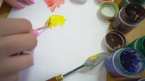 The process of mixing gouache paints palette knife Stock Footage 102497607