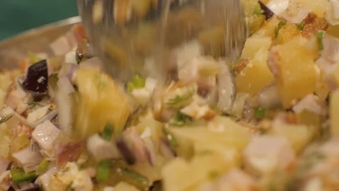 Process mixing ingredients vegetable salad with seasonings and herbs close up Stock Footage 90956032