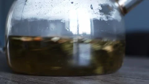 The process of mixing a tea blend in a teapot. Brewing herbal and fruit tea. Stock Footage 304160935