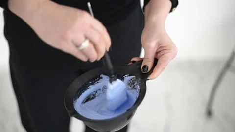 Process of mixing the two hair dyes Stock Footage 124852799