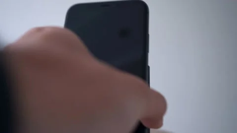 Process of mobile phone charging on an induction station pad. 4k stock footage. Vídeos de archivo 156414665